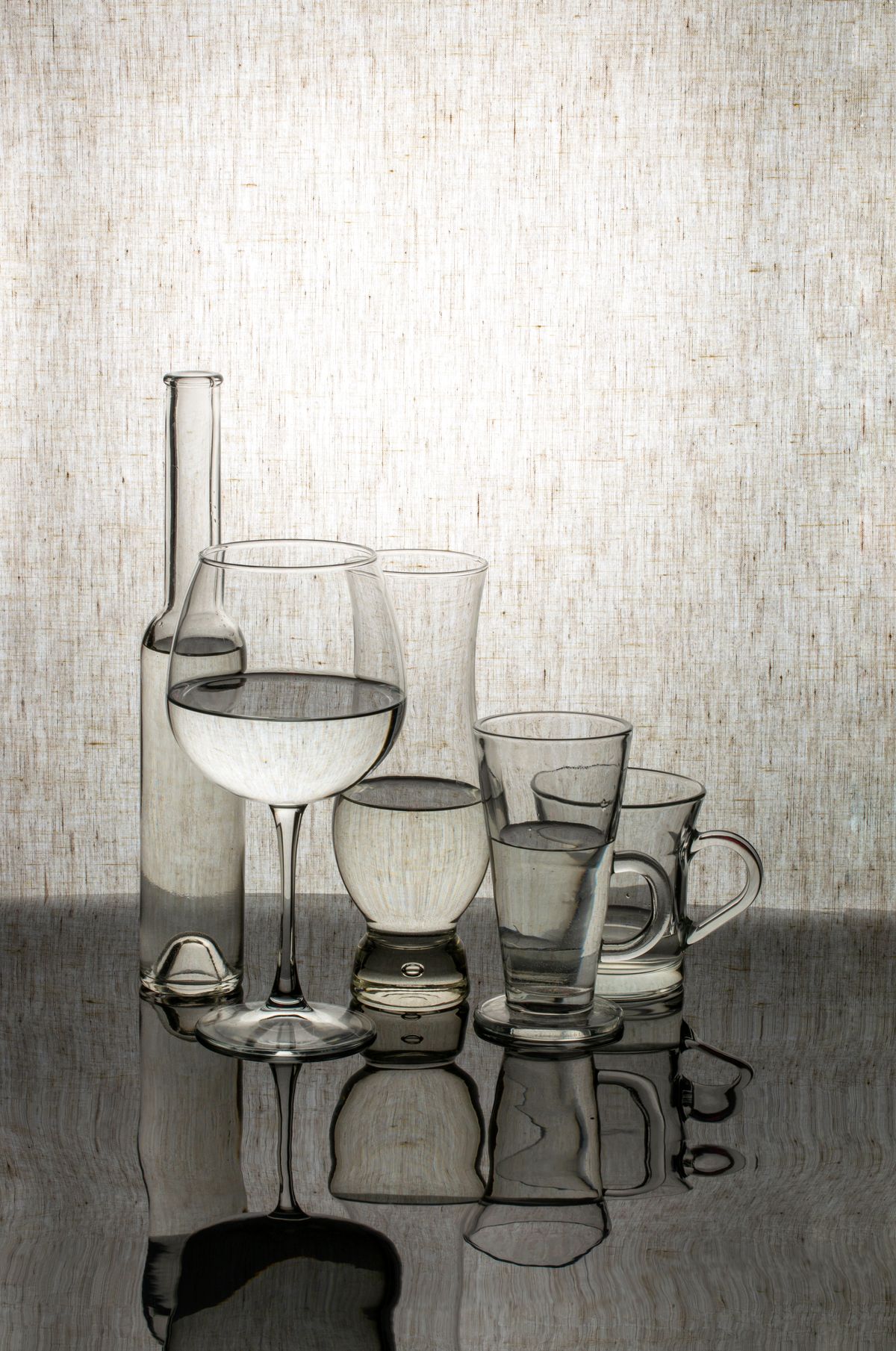 Illustrative collection of clear drinking glasses and cups